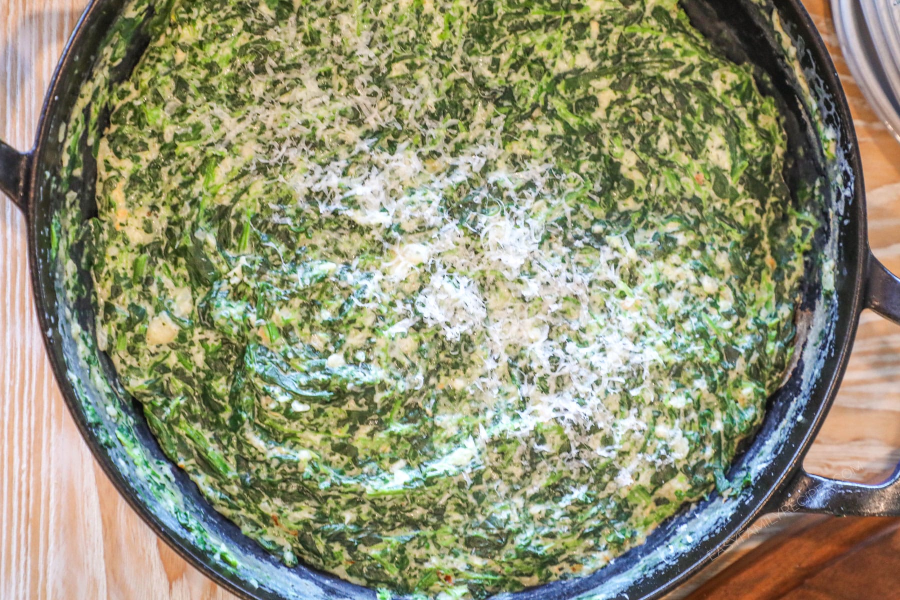 Easy creamed spinach in skillet with Parmesan.