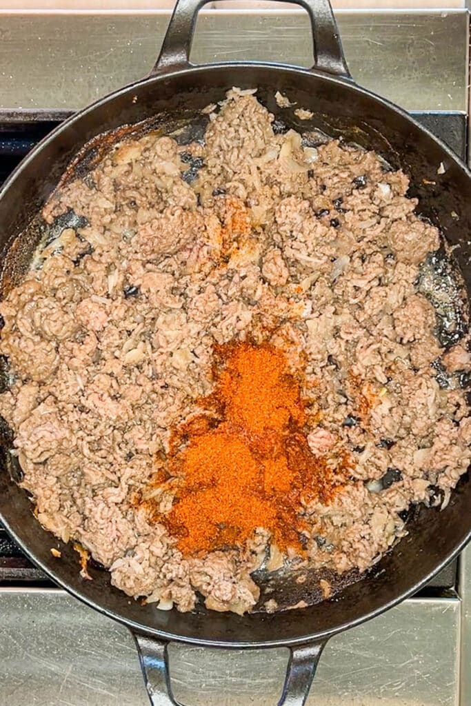 Ground beef and taco seasoning in skillet.