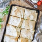 Sheet pan crunch wrap supreme on wooden countertop.
