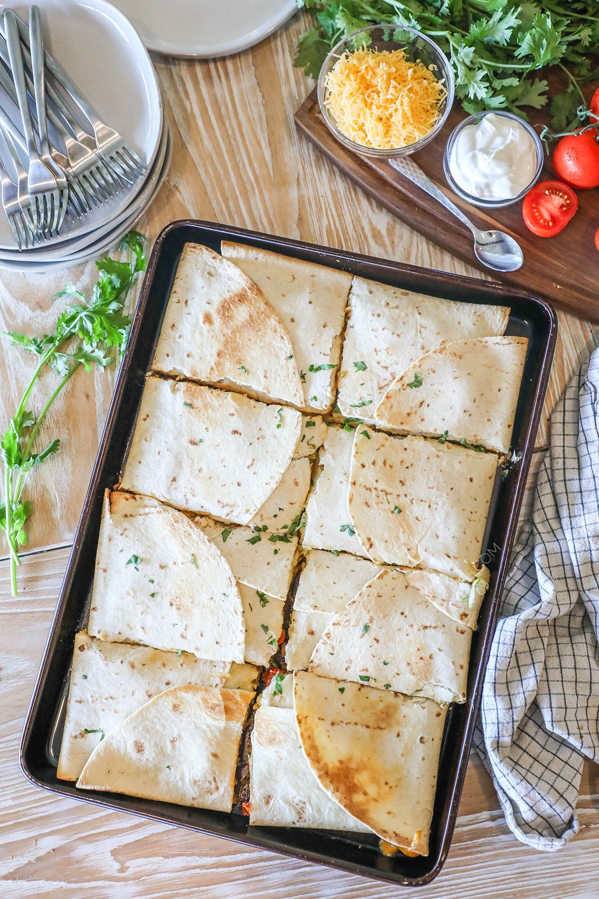 Sheet pan crunch wrap supreme on wooden countertop.